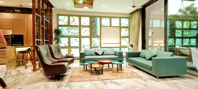 Modern Living Room Adorned in Green and Gold Tones