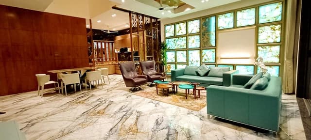 Modern Living Room Adorned in Green and Gold Tones