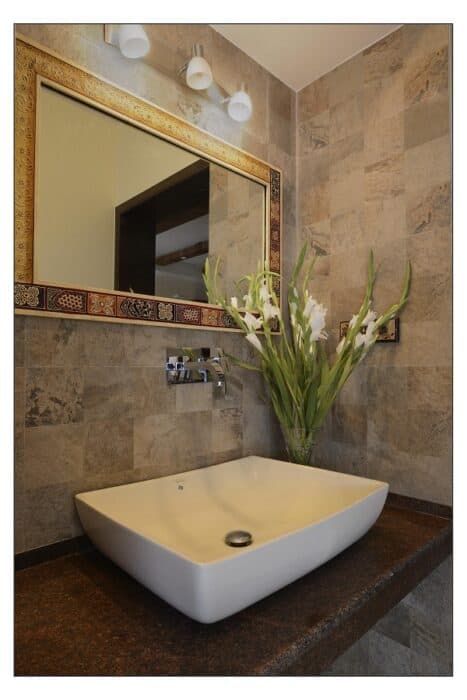 Modern Bathroom Vanity with Oval Sink and Dark Accents