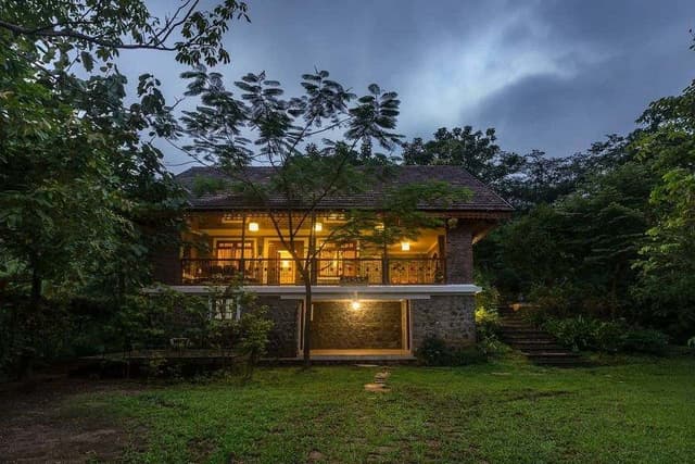 3-Story-Traditional-Bungalow-Farm-House-with-an-Contemporary-Touch-build-of-Natural-Stone-Brick-Exposed-Walls-Sloping-Roofs-with-Patterned-Eave-boards-2-1 Swiper Content 1