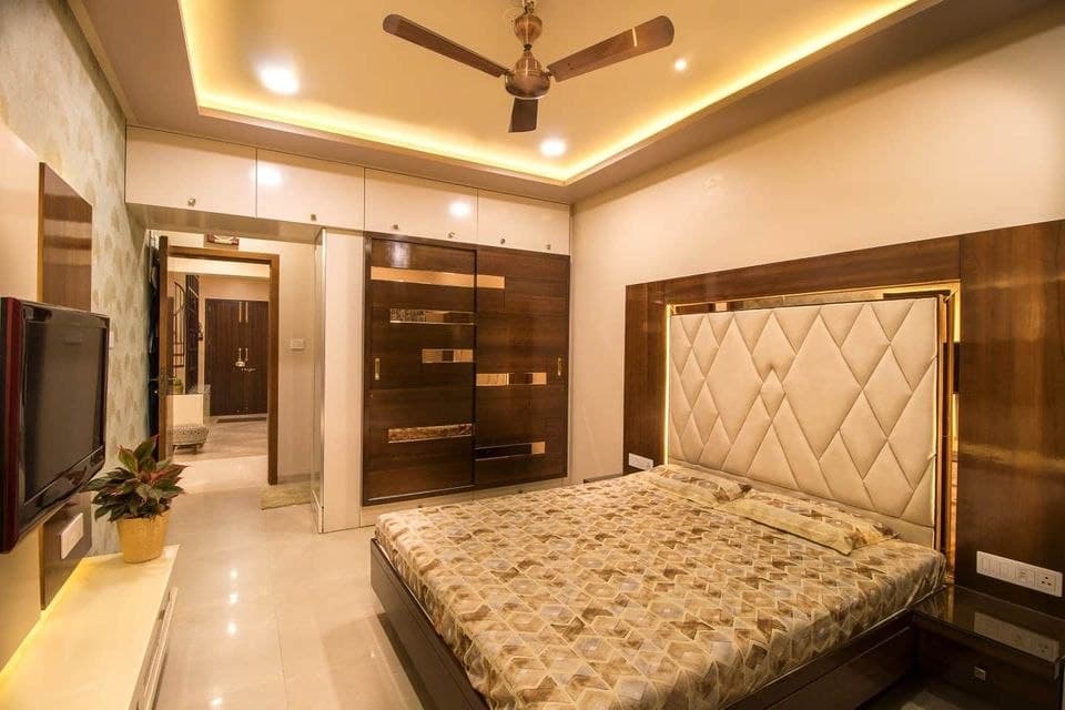 A-Bed-with-Diagonally-Tufted-Off-White-Coloured-Squares-on-the-High-Headboard-with-Wooden-Laminate-Beside-it-2-Side-Table-with-1-Drawers-on-Each-Side Design Detail Banner 0