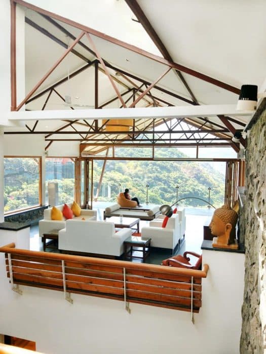 A-Living-Room-having-an-Elegant-View-of-River-Nature-surround-accommodating-White-Coloured-Square-Armed-Sofa.-1 Design Detail Banner 2