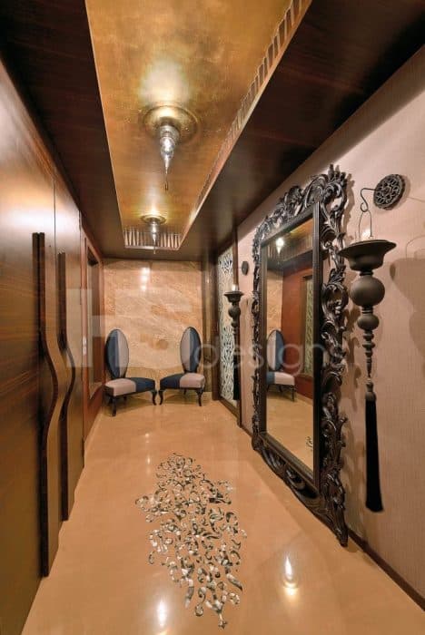 A-Royal-Seating-Area-comprising-of-Two-Toned-Classic-Semi-Circular-Chair-with-Oval-Back-Ceiling-Fitted-Cupboard-with-Wooden-Handles-Free-standing-Large-Mirror Swiper Content 0