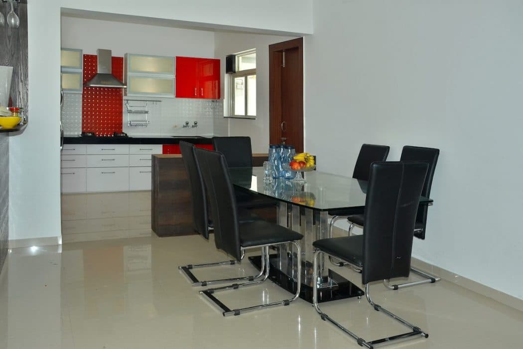 A-Six-Seater-SS-Base-Dining-Table-with-Glasstop-Octave-Cantilever-Chairs Design Detail Banner 0