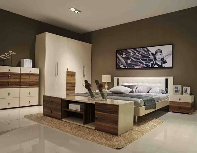 A-Unique-Bedroom-in-the-Shade-of-Ivory-Wooden-Finishes-with-a-Bed-Runner-Bed-End-Storage-Unit-with-Nice-Artifacts-over-it. Swiper Content 0