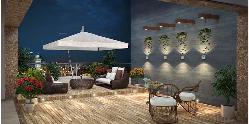 Balcony-designed-with-Outdoor-Sofa-Round-Coffee-Table-Tensile-Canopy-above-the-Seating-Area-Colourful-Indoor-Plants-1 Design Detail Banner 0