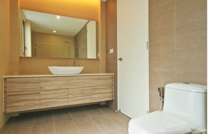 Bathroom-incorporating-Table-Top-Wash-Basin-on-White-Marble-Countertop-Wall-Mounted-Handle-less-Wooden-Cabinet-Wall-Mounted-Rectangular-Mirror-Floor-Mounted-WC-with-Flush-Tank-1 Design Detail Banner 0