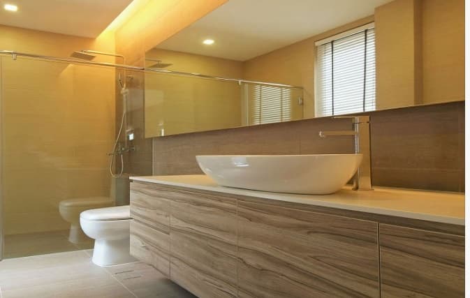 Bathroom-incorporating-Table-Top-Wash-Basin-on-White-Marble-Countertop-Wall-Mounted-Handle-less-Wooden-Cabinet-Wall-Mounted-Rectangular-Mirror-Floor-Mounted-WC-with-Flush-Tank. Design Detail Banner 1