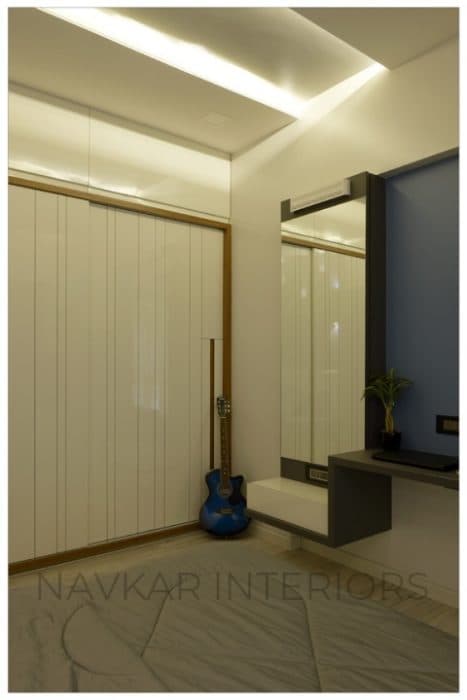 Bedroom-accommodating-Wooden-Double-Bed-with-Storage-below-Cushioned-Wooden-Headboard-Bed-Back-Wall-with-MDF-Wall-Panelling-highlighted-with-Vertical-Grooves-3 Design Detail Banner 2