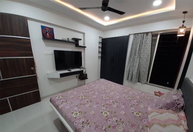 Bedroom-accomodating-Wooden-Double-Bed-with-Storage-below-Tufted-Upholstered-Headboard. Swiper Content 1