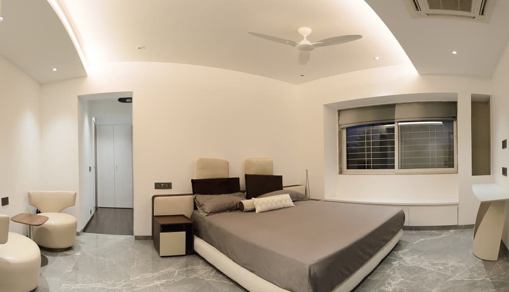 Bedroom-with-Grey-Tile-Flooring-comprises-of-Upholstered-King-Sized-Bed-with-Cushioned-Headboard Design Detail Banner 0