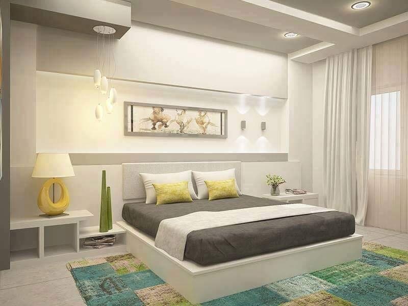 Bedroom-with-Platform-Double-Bed-with-Upholstered-Headboard-Wall-Painting-on-Bed-Back-Wall-with-LED-Wall-Lights-Wooden-Side-Tables-with-Table-Lamp-and-Vases-Colourful-Rug Design Detail Banner 0