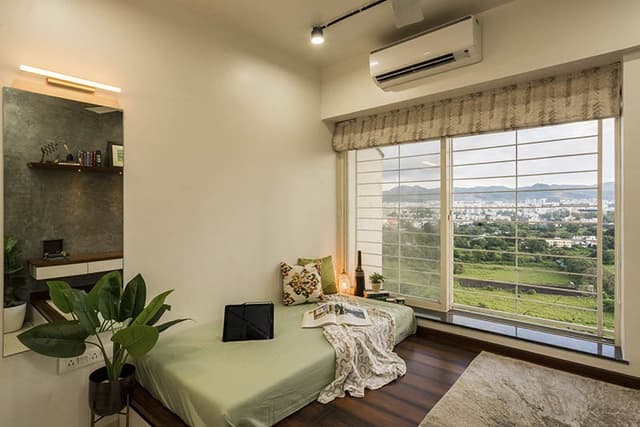 Bedroom-with-Raised-Wooden-Platform-comprising-of-Cushioned-Bed-Rug-Window-with-Roman-Roller-Blinds-Raised-Seating-1 Swiper Content 2