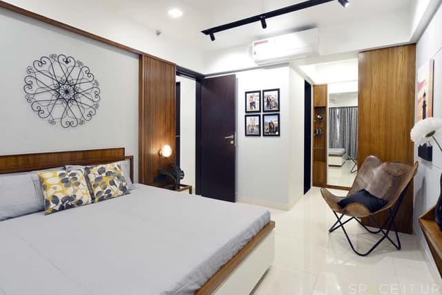 Bedroom-with-Wooden-Double-Bed-with-Storage-below-Bed-Back-Wall-with-Wooden-Headboard-Metal-Wall-Decor-1 Swiper Content 0