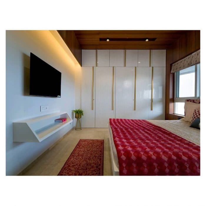 Bedroom-with-Wooden-Double-Bed-with-Storage-below-Wall-Mounted-Wooden-Side-Tables-Bed-Back-Wall-with-Wooden-Wall-Panelling-highlighted-with-Grooves-2 Design Detail Banner 1