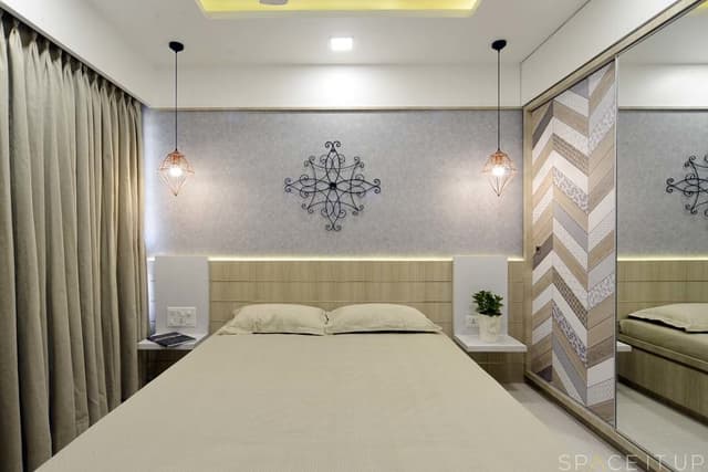 Bedroom-with-Wooden-Double-Bed-with-Storage-below-Wall-Mounted-Wooden-Side-Tables-Wooden-Headboard-with-Cove-Light-Bed-Back-Wall-with-Grey-Shaded-Wallpaper Swiper Content 0