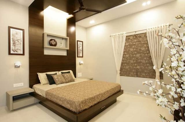 Bedroom-with-Wooden-Double-Bed-with-Storage-below-Wooden-Side-Tables-Wooden-Headboard-with-Rectangular-Wooden-Frame-continuing-in-Ceiling-1 Swiper Content 0