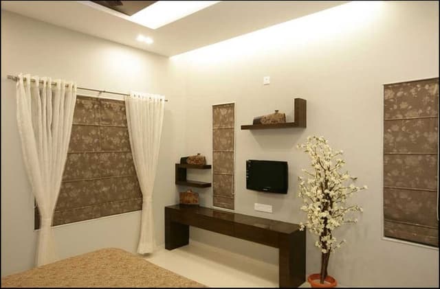 Bedroom-with-Wooden-Double-Bed-with-Storage-below-Wooden-Side-Tables-Wooden-Headboard-with-Rectangular-Wooden-Frame-continuing-in-Ceiling-2 Swiper Content 1