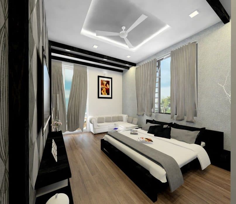 Bedroom-with-Wooden-Flooring-comprises-of-Wooden-Double-Bed-Wooden-Headboard-Bed-Back-Wall-with-Window-having-Curtain-French-Window-with-Drapes-leading-to-Balcony Bedroom