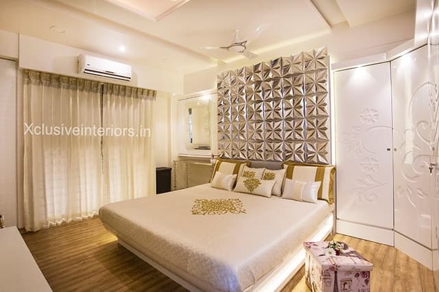 Bedroom-with-Wooden-Flooring-comprises-of-Wooden-Double-Bed-highlighted-with-Cove-Lights Swiper Content 0