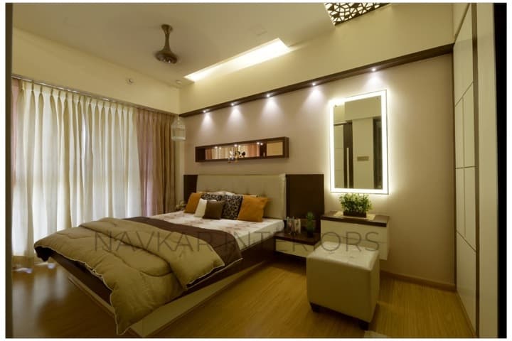 Bedroom-with-Wooden-Flooring-comprises-of-Wooden-Double-Bed-with-Storage-below-Wall-Mounted-Wooden-Side-Table-Bed-Back-Wall-with-Niche-highlighted-with-Spot-Lights-2 Design Detail Banner 1