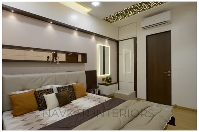 Bedroom-with-Wooden-Flooring-comprises-of-Wooden-Double-Bed-with-Storage-below-Wall-Mounted-Wooden-Side-Table-Bed-Back-Wall-with-Niche-highlighted-with-Spot-Lights-3 Swiper Content 2
