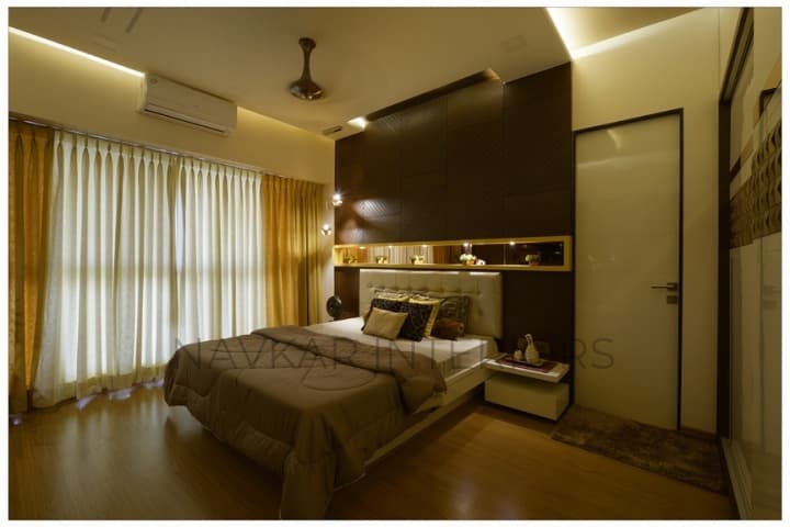 Bedroom-with-Wooden-Flooring-comprises-of-Wooden-Double-Bed-with-Storage-below-Wall-Mounted-Wooden-Side-Tables-Tufted-Upholstered-Headboard-1 Design Detail Banner 0