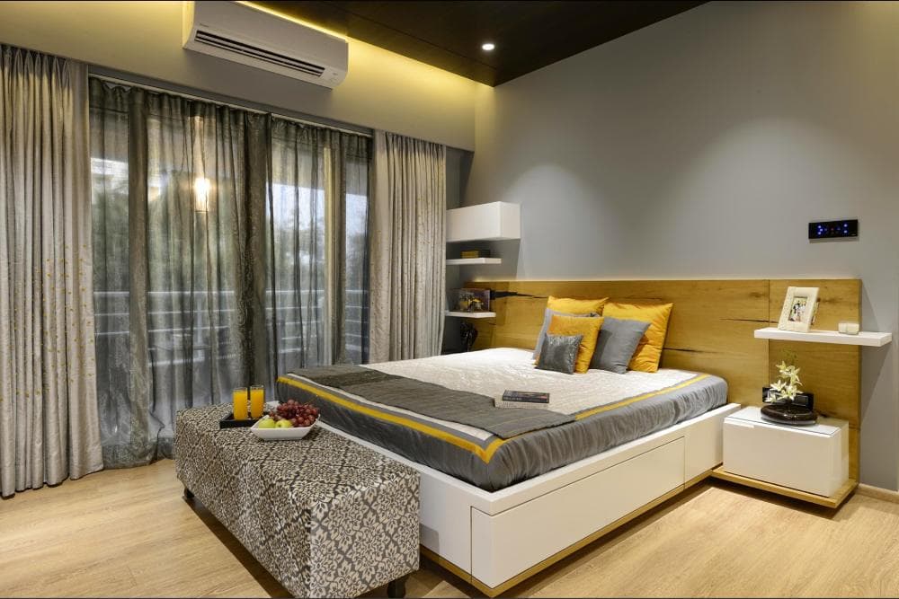 Bedroom-with-Wooden-Flooring-comprises-of-Wooden-Double-Bed-with-Storage-below-Wooden-Side-Tables-on-Wall-Mounted-Wooden-Shelf-1 Bedroom with Wooden Flooring comprises of Wooden Double Bed