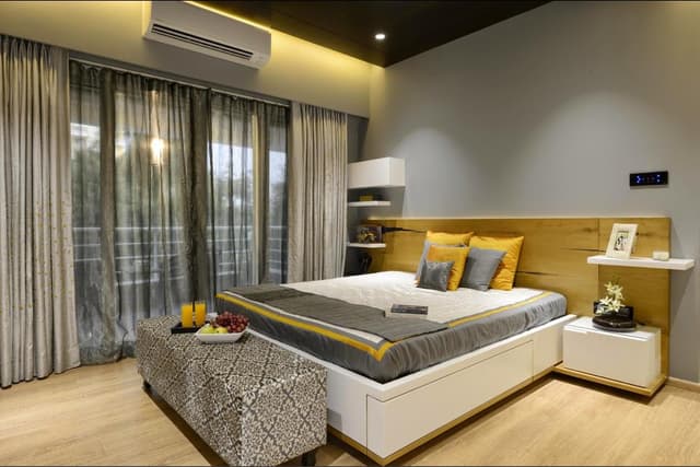 Bedroom-with-Wooden-Flooring-comprises-of-Wooden-Double-Bed-with-Storage-below-Wooden-Side-Tables-on-Wall-Mounted-Wooden-Shelf-1 Bedroom with Wooden Flooring comprises of Wooden Double Bed