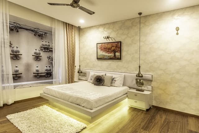 Bedroom-with-Wooden-Flooring-comprises-of-Wooden-Double-Bed-with-Storage-below-highlighted-with-Cove-Light-3 Swiper Content 2