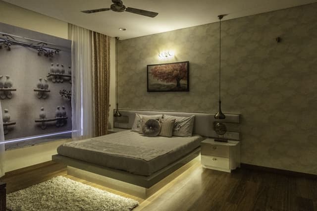 Bedroom-with-Wooden-Flooring-comprises-of-Wooden-Double-Bed-with-Storage-below-highlighted-with-Cove-Light-4 Swiper Content 3