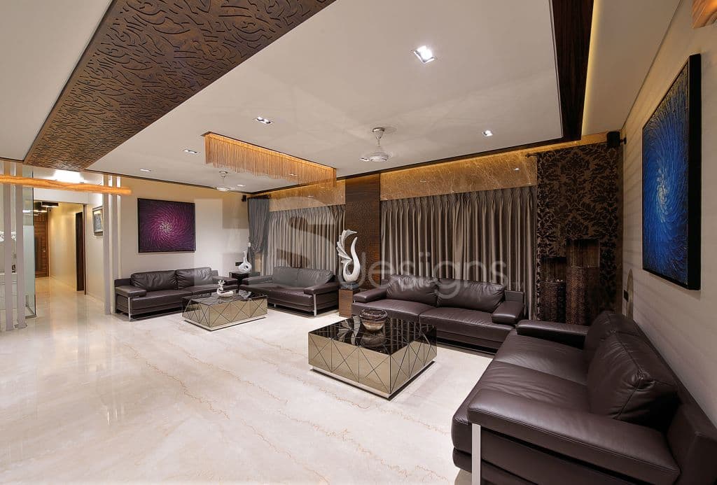 Big-Living-Room-incorporating-Classic-Dark-Brown-Leather-Square-Armed-Sofa-Set-with-Center-Full-Glazed-Coffee-Tables-Side-Table-with-Showpiece-Sofa-Back-Wall-with-Big-Window-having-Drapes. Design Detail Banner 0