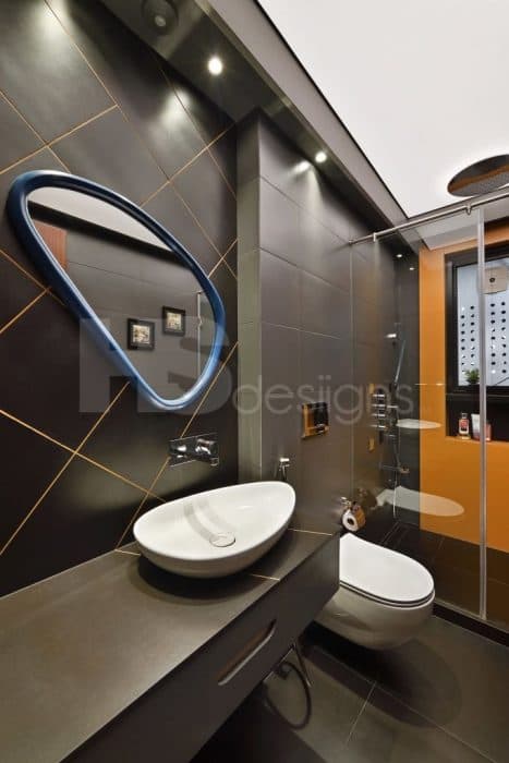 Black-Coloured-Bathroom-incorporating-Table-Top-Wash-Basin-and-Under-Counter-Drawers-Mirror-with-Metal-Frame-with-Black-Tile-in-Diamond-Shape-and-highlighted-with-Gold-Epoxy-Grout-Glitter. Design Detail Banner 0