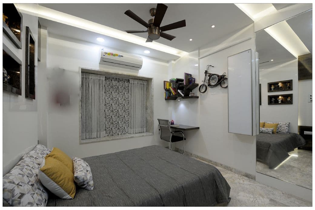 Black-White-theme-in-Teenagers-Bedroom-accommodating-Wooden-Bed-with-Printed-Cushions-01 Design Detail Banner 0