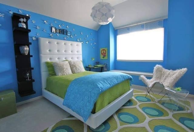 Blue-Themed-Bedroom-accommodating-Wooden-Double-Bed-White-Button-Tufted-Upholstered-High-Headboard-Wall-Mounted-Seating-in-front-of-Window-Pattern-Rug-Acrylic-Coffee-Table Swiper Content 0
