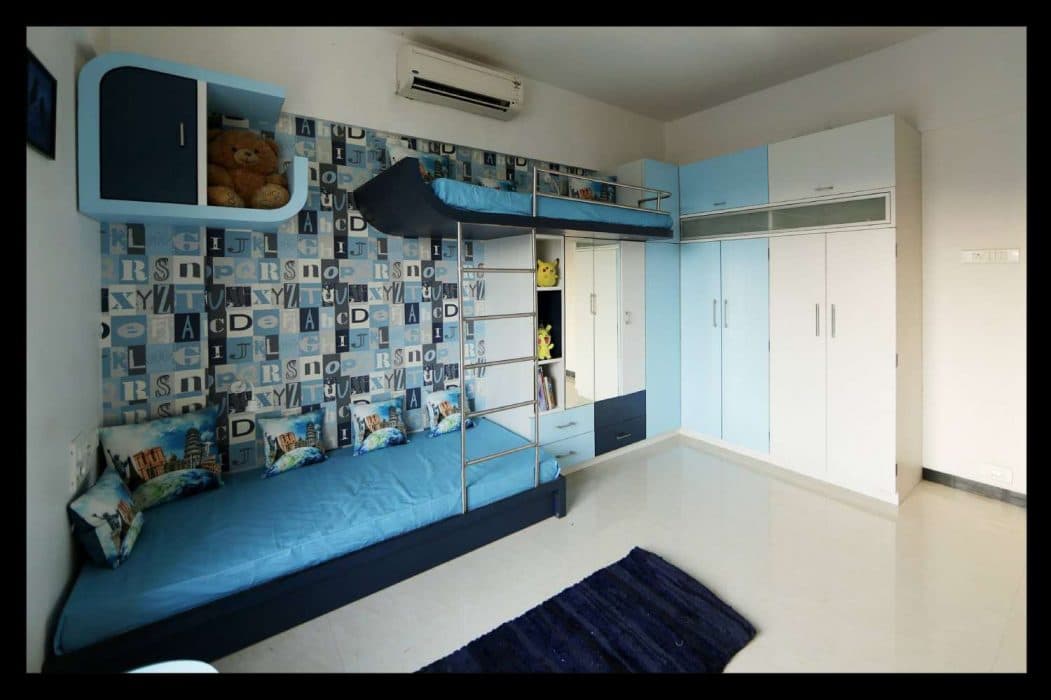 Blue-Themed-Children-Bedroom-accommodating-a-Custom-made-Wooden-Bunkbed-with-SS-Ladder-Adjoining-Dressing-Unit-with-Drawers-Mirror-Open-Display-Boxes-for-Toys-2 Design Detail Banner 1
