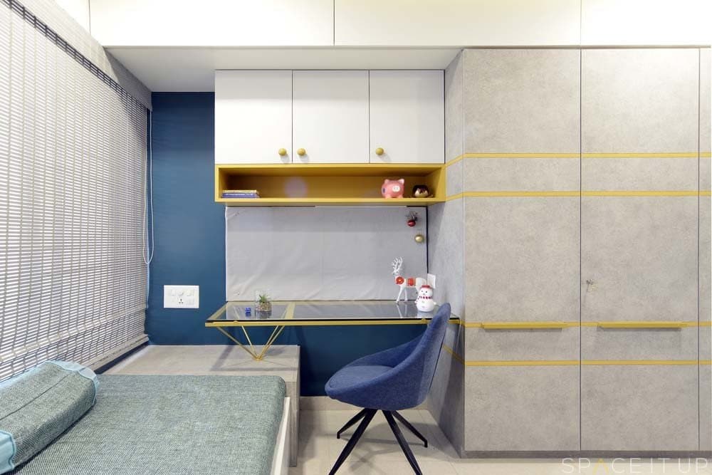 Ceiling-Fitted-Wardrobe-has-Yellow-Highlighters-Horizontal-Wooden-Handles-Attached-Study-Table-with-Glass-Top-1 Design Detail Banner 0