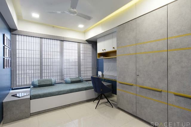 Ceiling-Fitted-Wardrobe-has-Yellow-Highlighters-Horizontal-Wooden-Handles-Attached-Study-Table-with-Glass-Top-2 Swiper Content 1