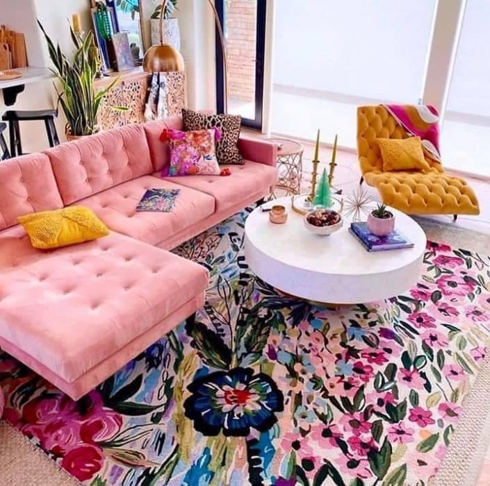 Chic-Maximalist-Living-Room-with-an-highlighting-Light-Pink-Coloured-Button-Tufted-Sectional-Sofa-with-Left-Facing-Chaise-Colourful-Cushions Design Detail Banner 0