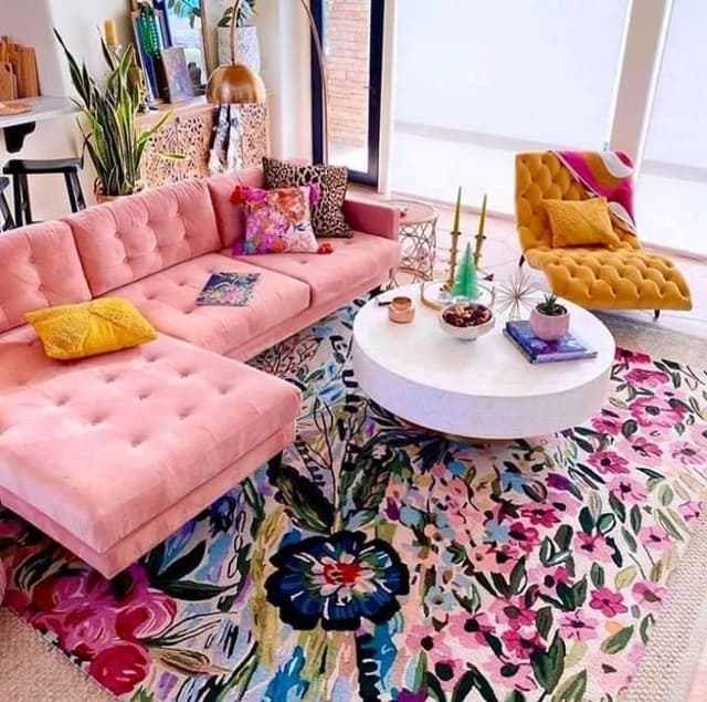 Chic-Maximalist-Living-Room-with-an-highlighting-Light-Pink-Coloured-Button-Tufted-Sectional-Sofa-with-Left-Facing-Chaise-Colourful-Cushions Swiper Content 0