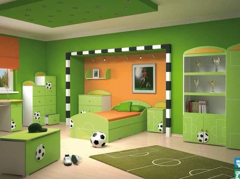 Children-Boys-Bedroom-in-a-Football-Theme-with-a-Single-Bed-Side-Table-Chest-of-Drawers-in-a-Niche-incl.-Wall-Art-Shelf-Display-Cupboard-for-Trophies-Study-Table-Drawers-Unit Children Bedroom