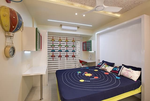 Childrens-Bedroom-incorporating-Wooden-Folding-Double-Bed-Study-Table-supported-by-Metal-Pole-Revolving-Chair Swiper Content 0