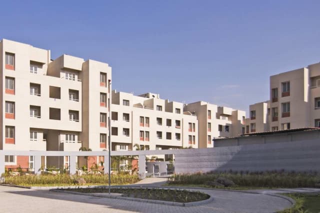 Cluster-of-5-Storeyed-Apartment-Buildings-with-Lush-Green-Lawn-in-the-center-Concrete-Pathway-leading-to-Gardens-1 Swiper Content 0