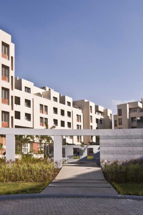 Cluster-of-5-Storeyed-Apartment-Buildings-with-Lush-Green-Lawn-in-the-center-Concrete-Pathway-leading-to-Gardens-6 Swiper Content 5