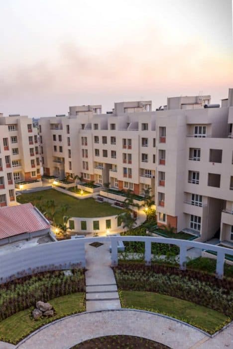 Cluster-of-5-Storeyed-Apartment-Buildings-with-Lush-Green-Lawn-in-the-center-Concrete-Pathway-leading-to-Gardens-7 Swiper Content 6