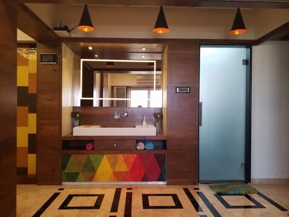 Common-Wash-Basin-Area-accommodating-Table-Top-Wash-Basin-with-Colourful-Wooden-Vanity-Cabinet-below-it Design Detail Banner 0