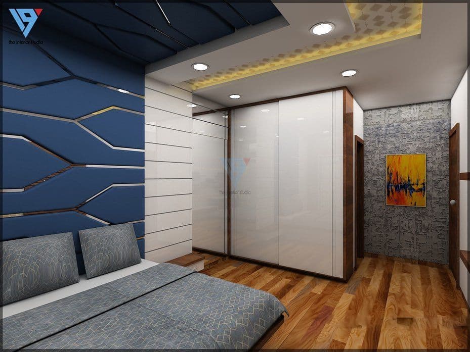 Contemporary-Bedroom-design-with-a-Wooden-Bed-Attached-Side-Tables-Bed-Backwall-Paneled-in-a-Zig-Zag-Line-with-Grooves-as-Transparent-Glass-Study-Table-2 Design Detail Banner 1