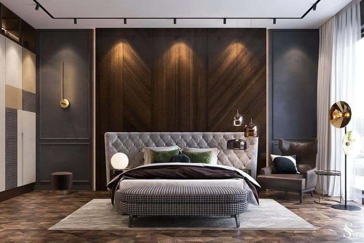 Contemporary-Bedroom-designed-with-Wooden-Bed-Cushioned-Headboard-Wooden-Backwall-highlighted-by-Spot-Lights Design Detail Banner 0
