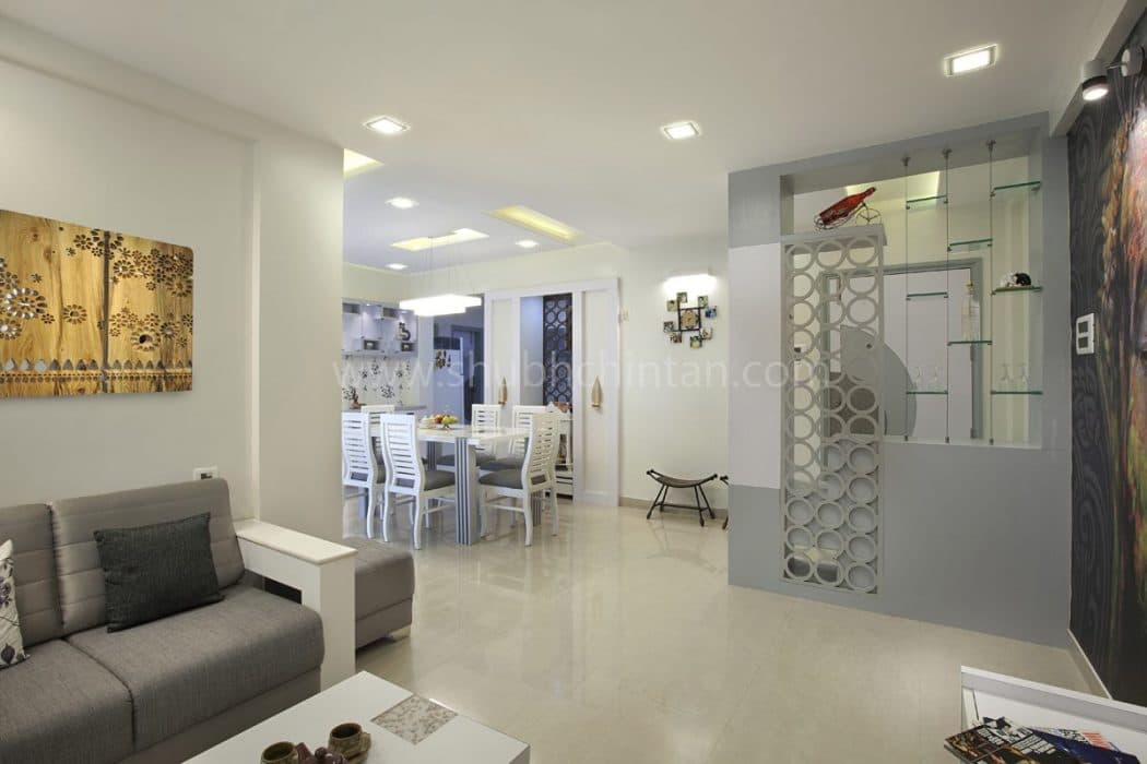 Contemporary-Living-Room-designed-with-Square-Armed-Sofa-Set-with-a-Corner-Table-Wall-Art-on-Back-wall-of-Sofa Design Detail Banner 1