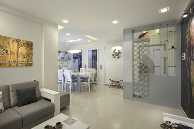 Contemporary-Living-Room-designed-with-Square-Armed-Sofa-Set-with-a-Corner-Table-Wall-Art-on-Back-wall-of-Sofa Swiper Content 1